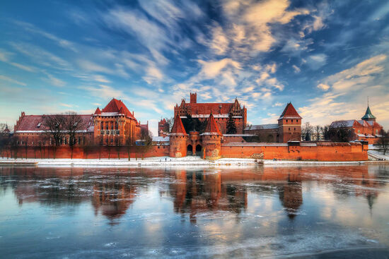 Malbork Castle with the River Nogat in the foreground. Once a fortress for the Teutonic  Order, the castle served for over 300 years as a Polish royal residence (photo © Patryk Kosmider / dreamstime.com).