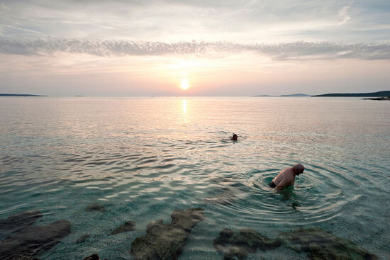 Sunset swimmers on Silba, an island in northern Dalmatia, Croatia (photo © Rudolf Abraham).